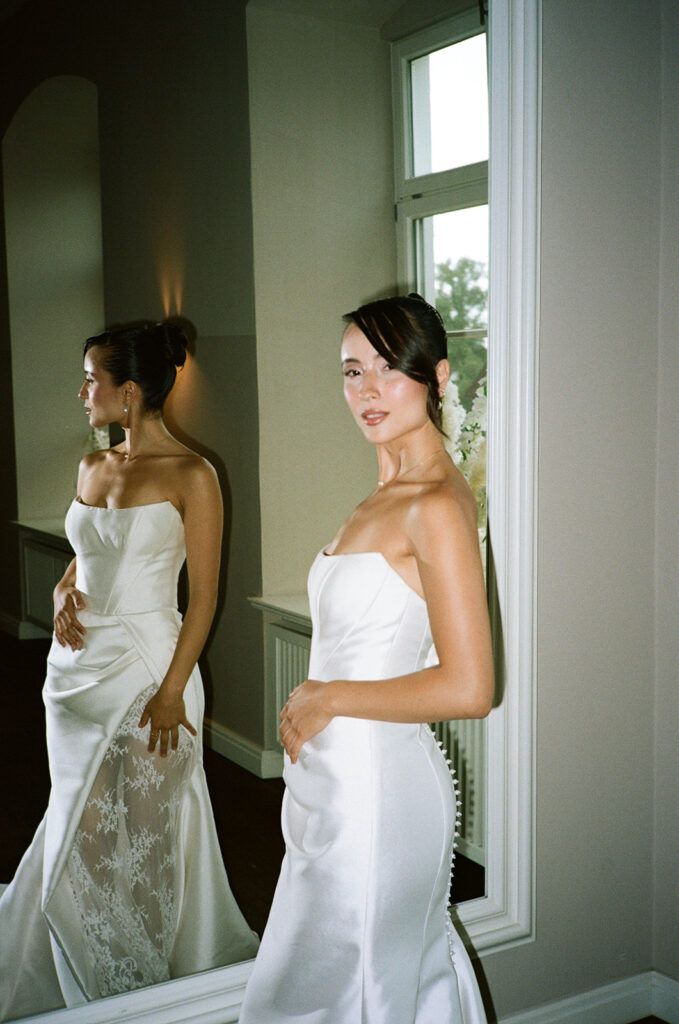 Bride posing at the wedding venue Schlossgut Gross Schwansee