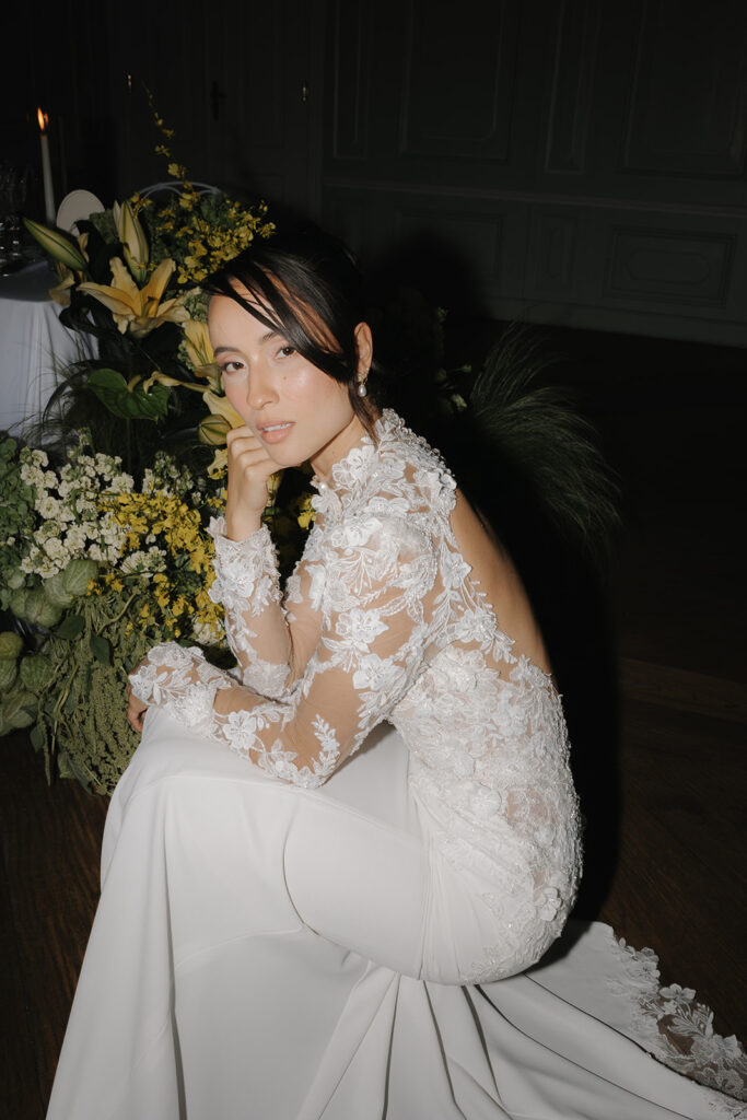 Bride with a long-sleeved lace dress in a stylish editorial setting in Hamburg