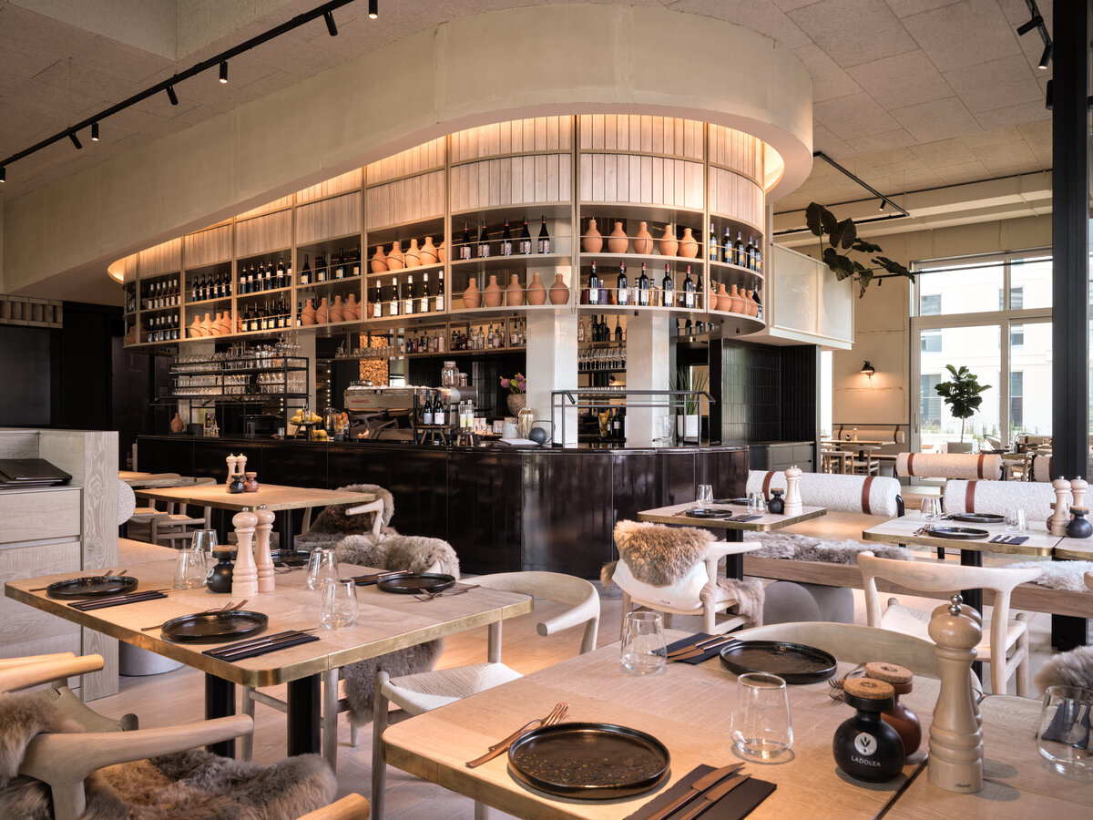 Modern restaurant interior with high ceilings and lots of light